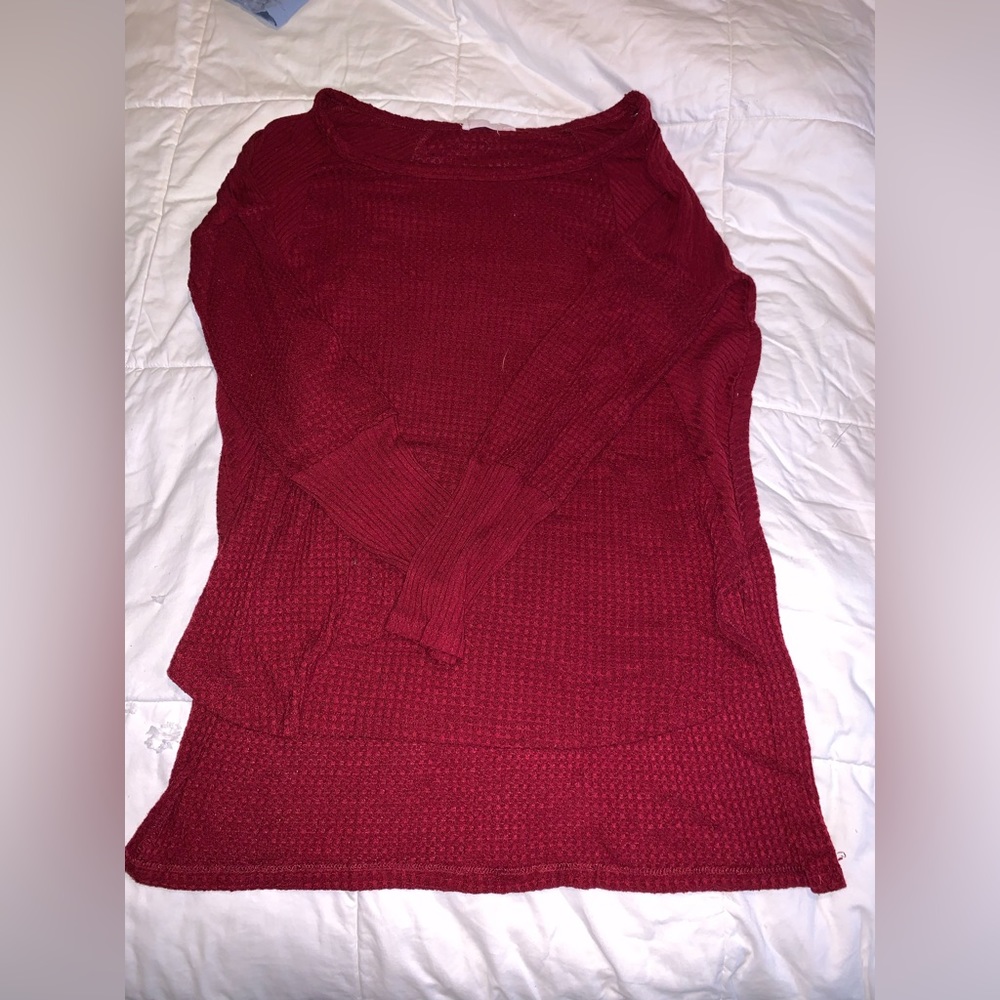 Women’s long sleeved sweater.